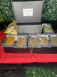 a box of different types of herbs and spices on a table